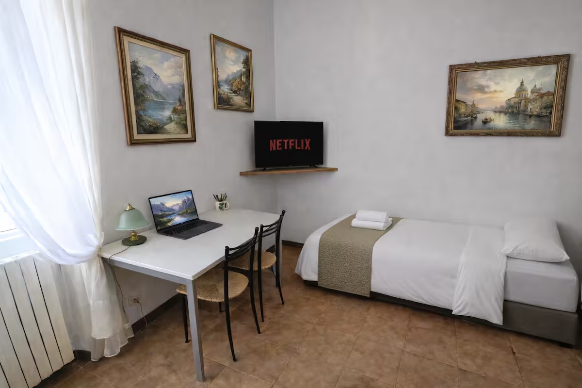 Dedicated workspace with desk and TV