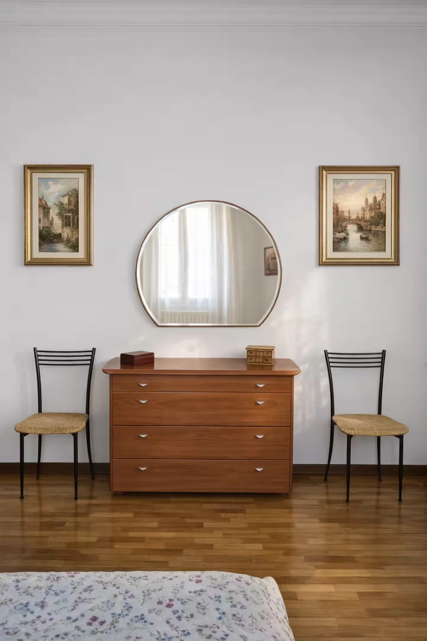 Bedroom detail with wooden dresser, large mirror and polished floor.
